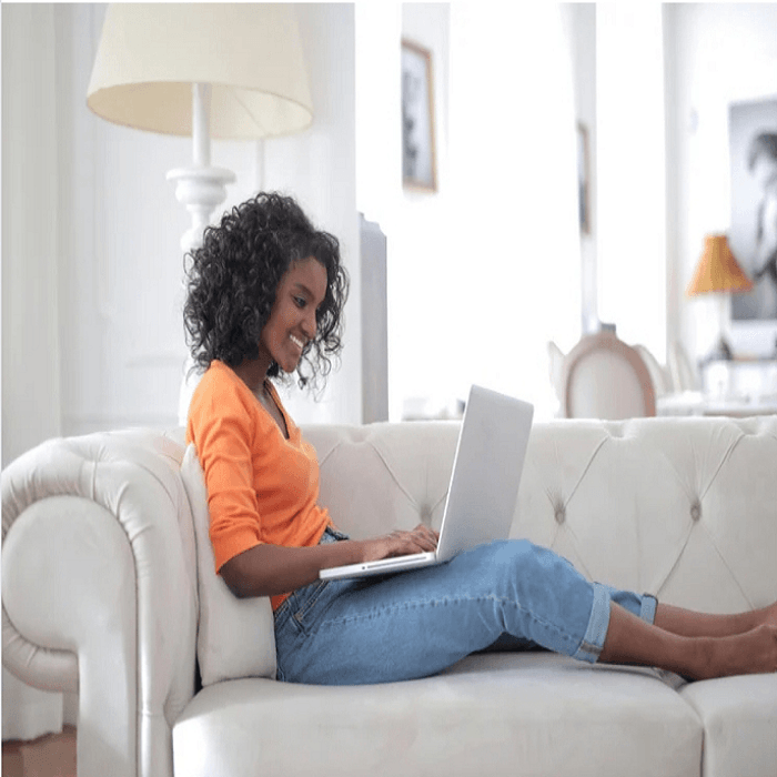 Smiling freelancer with laptop